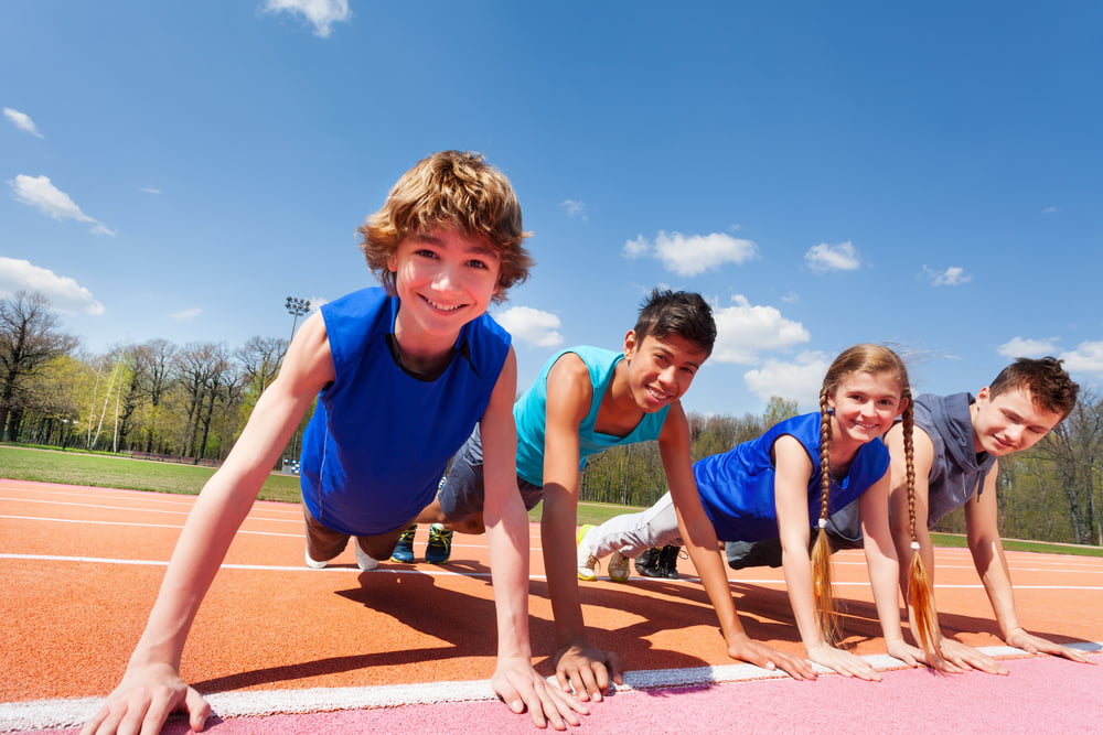 Happy,Teenagers,Holding,Plank,Outdoor,On,The,Track